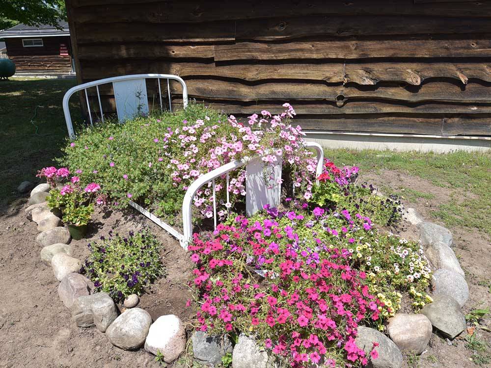 Rock lined flower bed at GLENVIEW COTTAGES & RV PARK