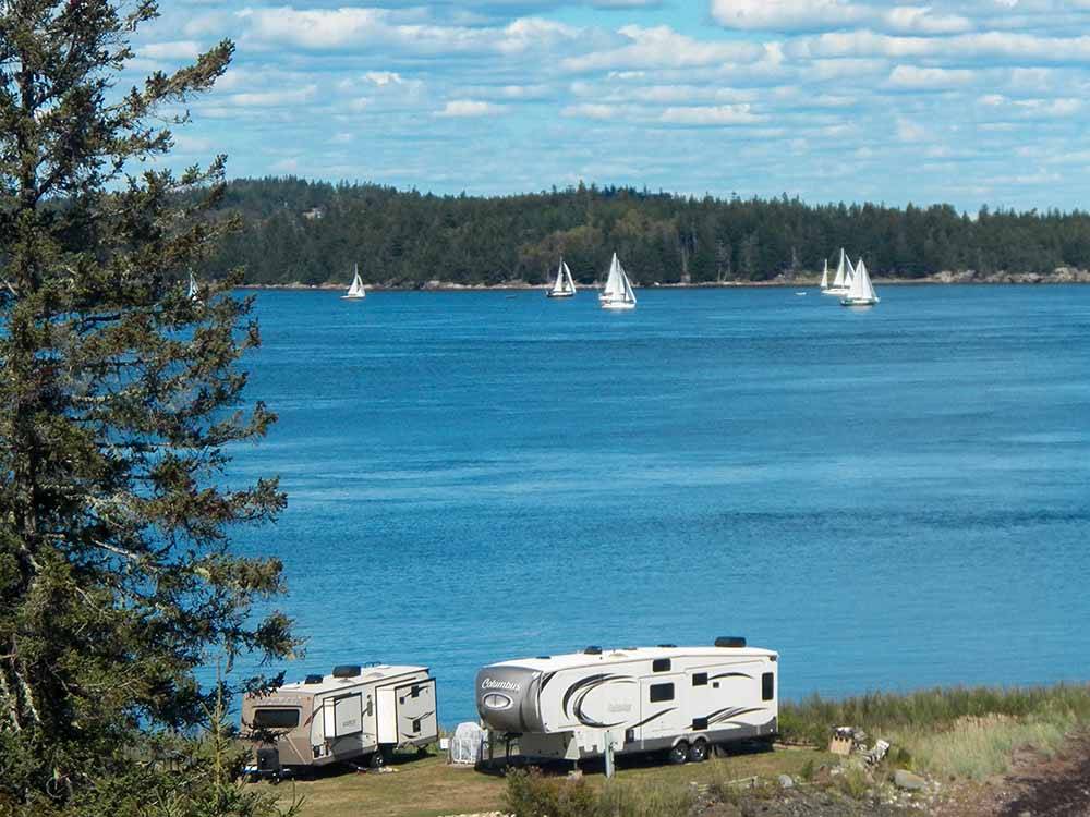 Sailboats with RVs in the foreground at SEAVIEW CAMPGROUND & COTTAGES