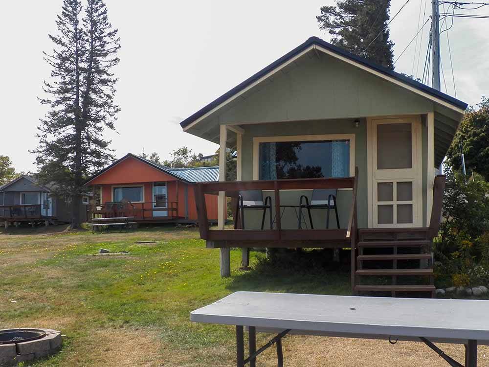 A row of colorful rental cottages at SEAVIEW CAMPGROUND & COTTAGES