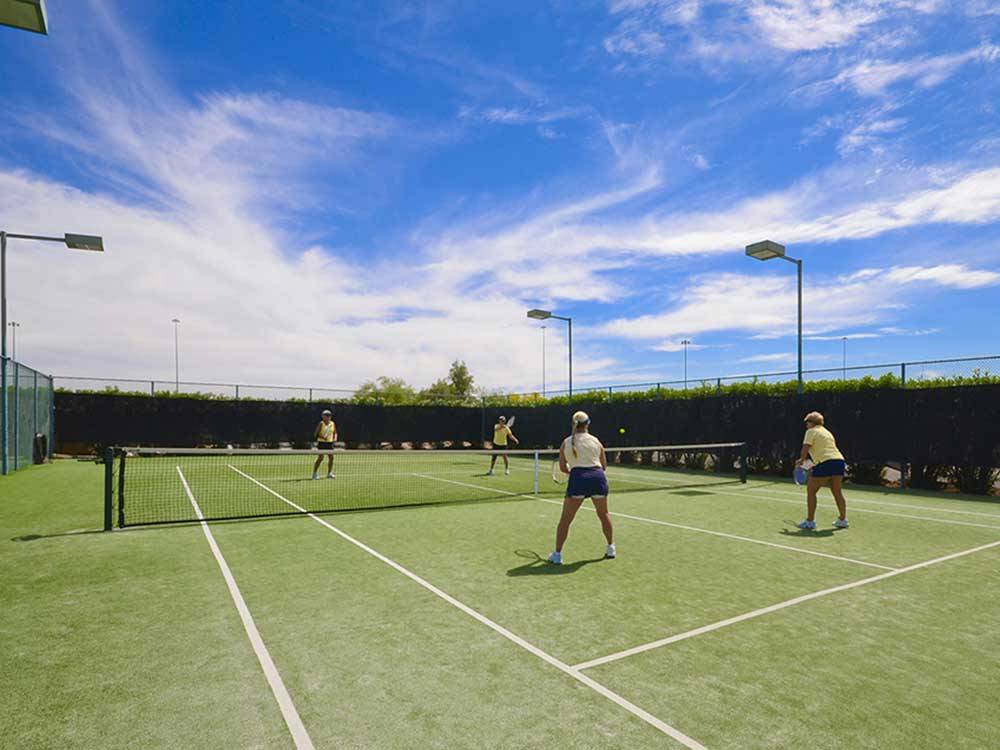 Couples playing tennis at VALLE DEL ORO RV RESORT