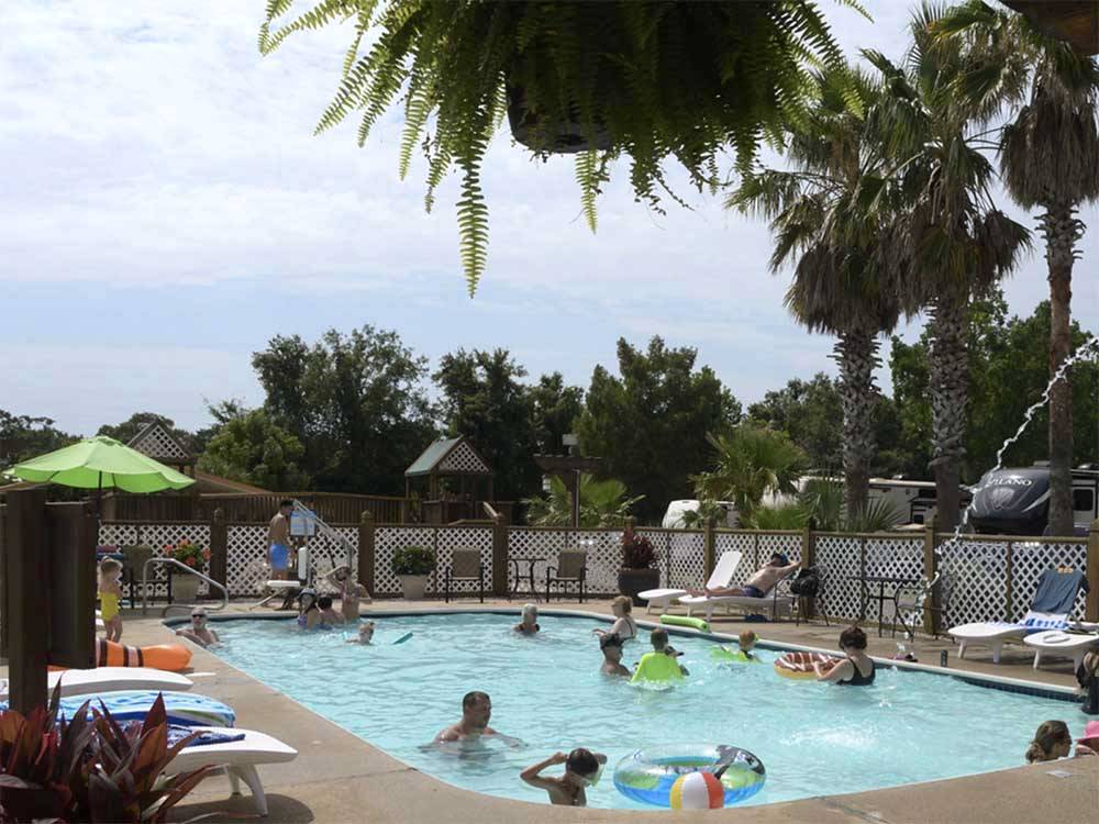 People playing in the pool at CAJUN RV PARK