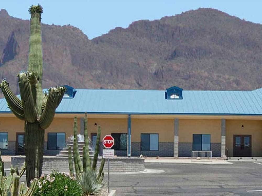 Fountain in parking lot with mountains in background at ARIZONIAN RV RESORT