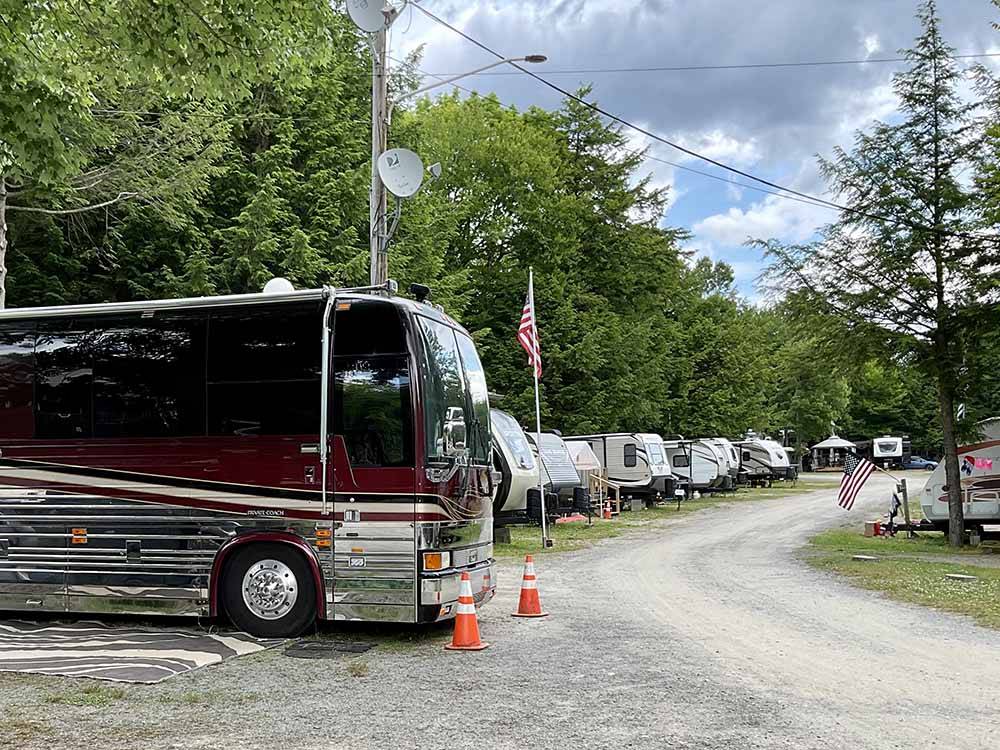 A row of RVs in back in sites at KATAHDIN SHADOWS CAMPGROUND & CABINS