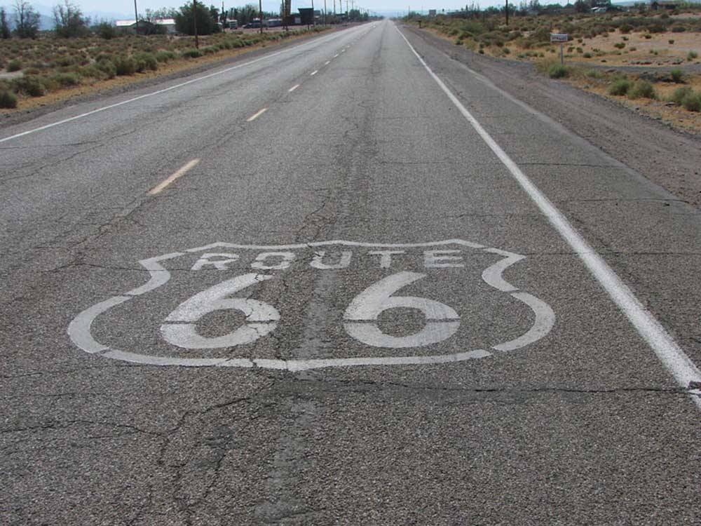 Route 66 painted on a street nearby at DESERT WILLOW RV RESORT