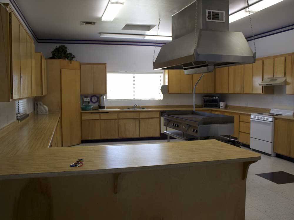 The communal kitchen area at DESERT WILLOW RV RESORT