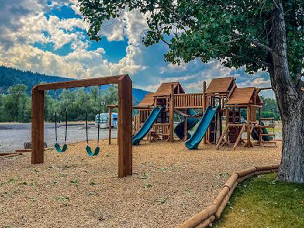 The children's playground with a swing set at SWAN VALLEY RV PARK