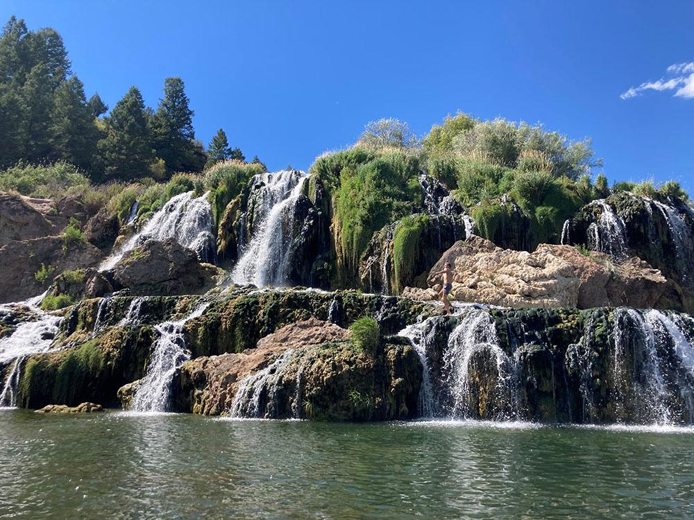 A mountain with beautiful waterfalls nearby at SWAN VALLEY RV PARK