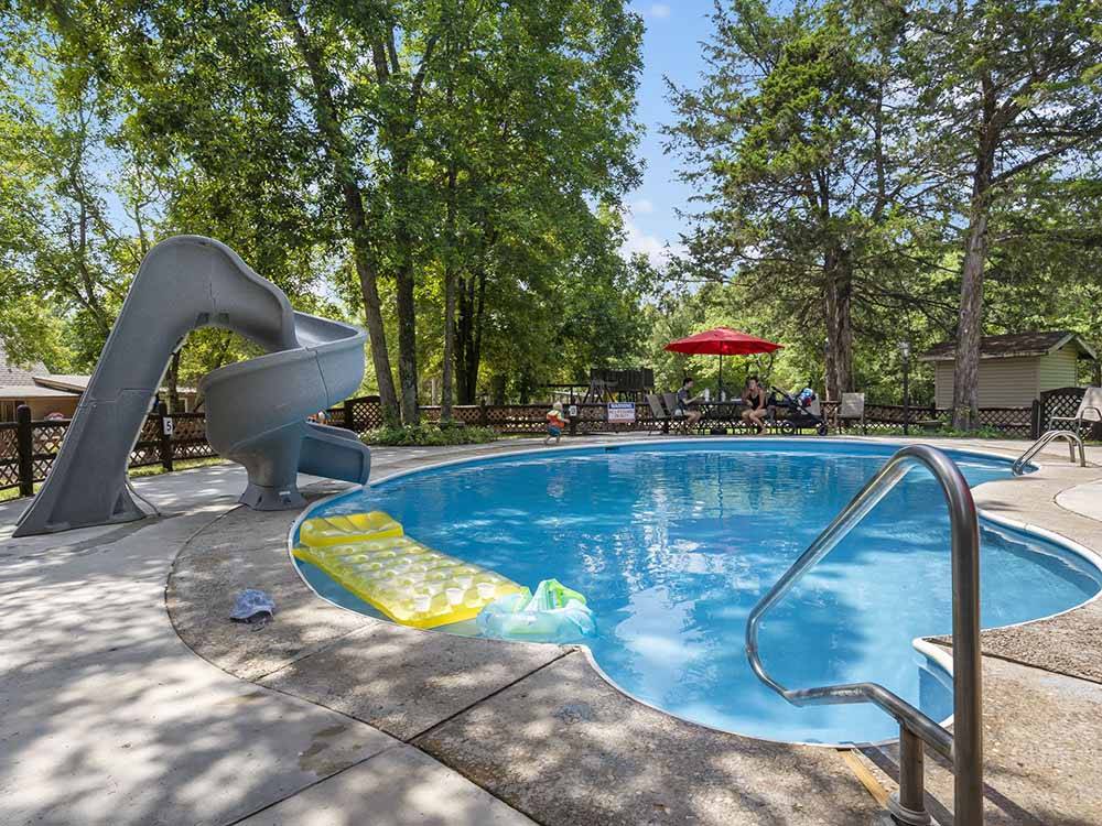 The swimming pool with a slide at BAR M RESORT & CAMPGROUND