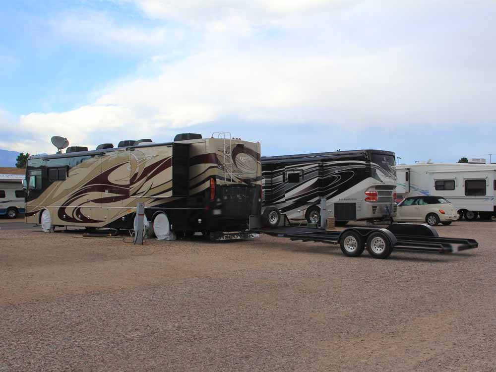 Motorhomes parked in gravel RV sites at MCARTHUR'S TEMPLE VIEW RV RESORT