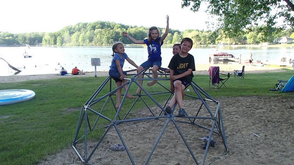 Kids playing on a geodesic dome