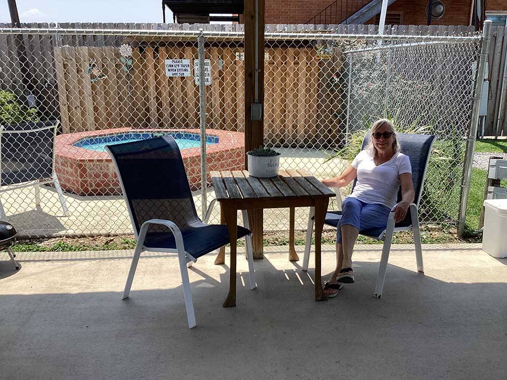 A lady next to the hot tub at JUDE TRAVEL PARK OF NEW ORLEANS