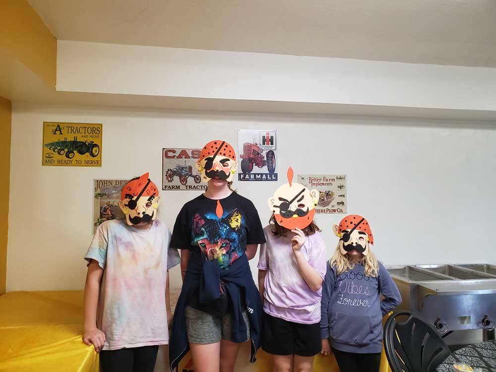 Four kids wearing pirate paper mask at CAMELOT CAMPGROUND QUAD CITIES