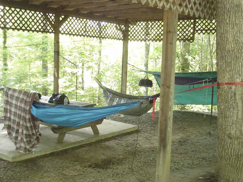 A row of hammocks in a pavilion at FLAMING ARROW CAMPGROUND