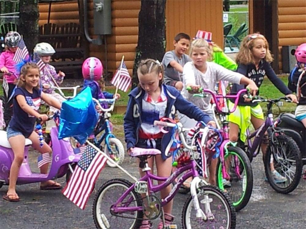 Children on bicycles at TWO RIVERS CAMPGROUND