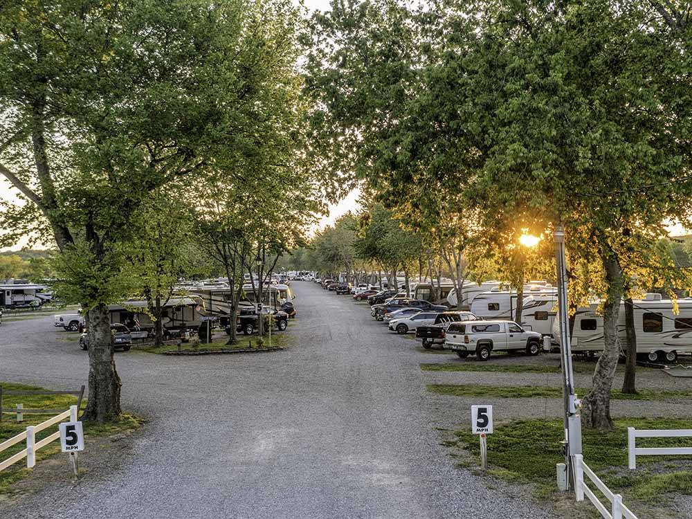 Looking down the road to the sites full of RVs and trailers at RIVERSIDE RV PARK & RESORT