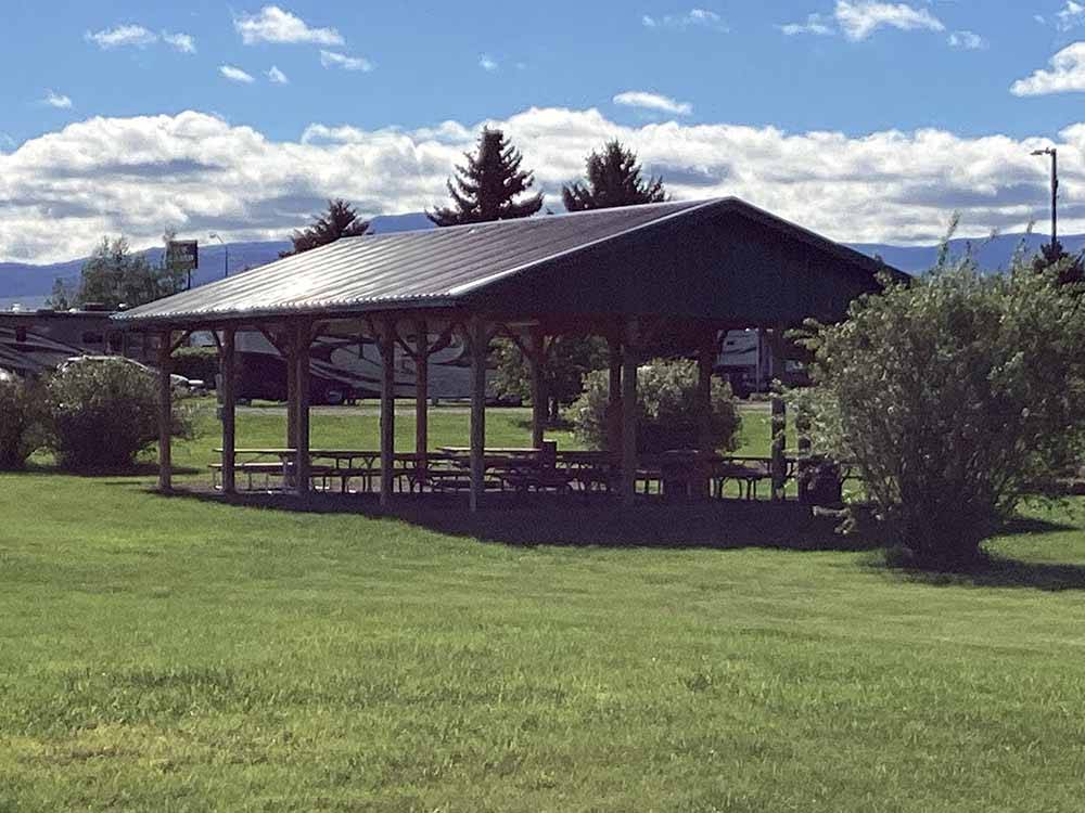 Picnic tables under the pavilion at INDIAN CREEK RV PARK & CAMPGROUND