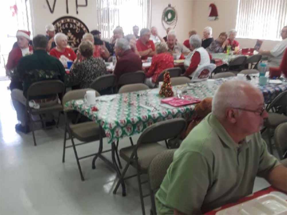 People eating inside at Christmas time at VIP RV RESORT & STORAGE