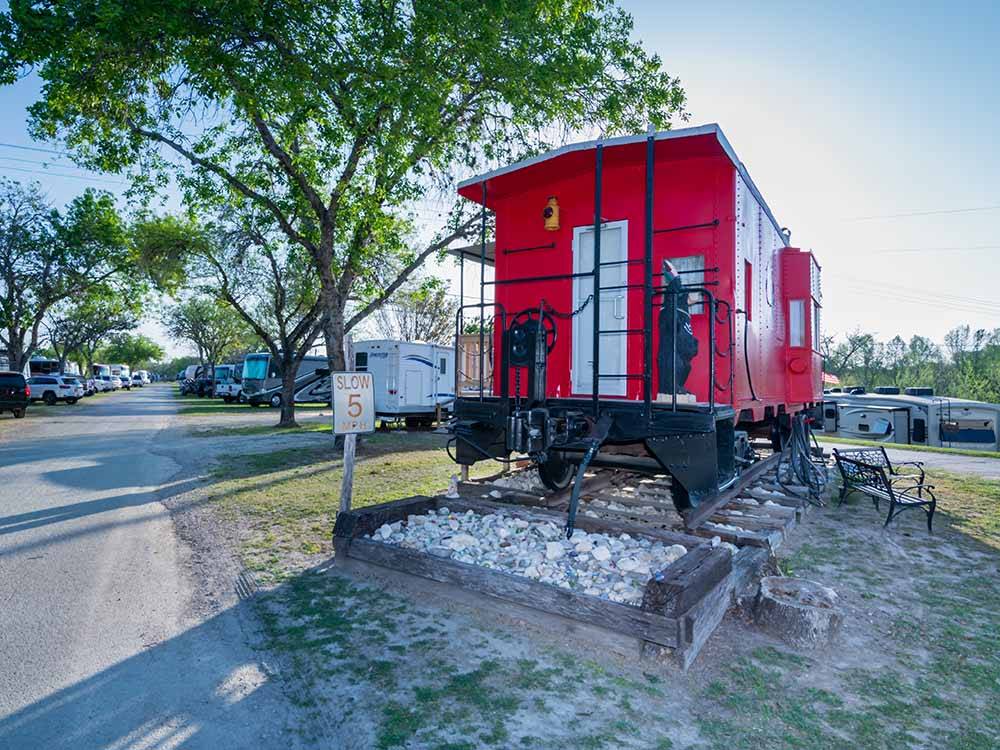 The back end of the red caboose at BANDERA PIONEER RV RIVER RESORT