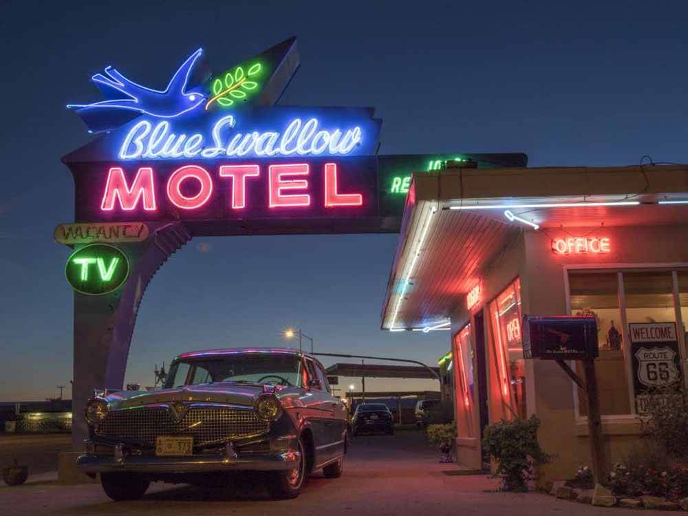 The neon Blue Swallow Motel sign at MOUNTAIN ROAD RV PARK