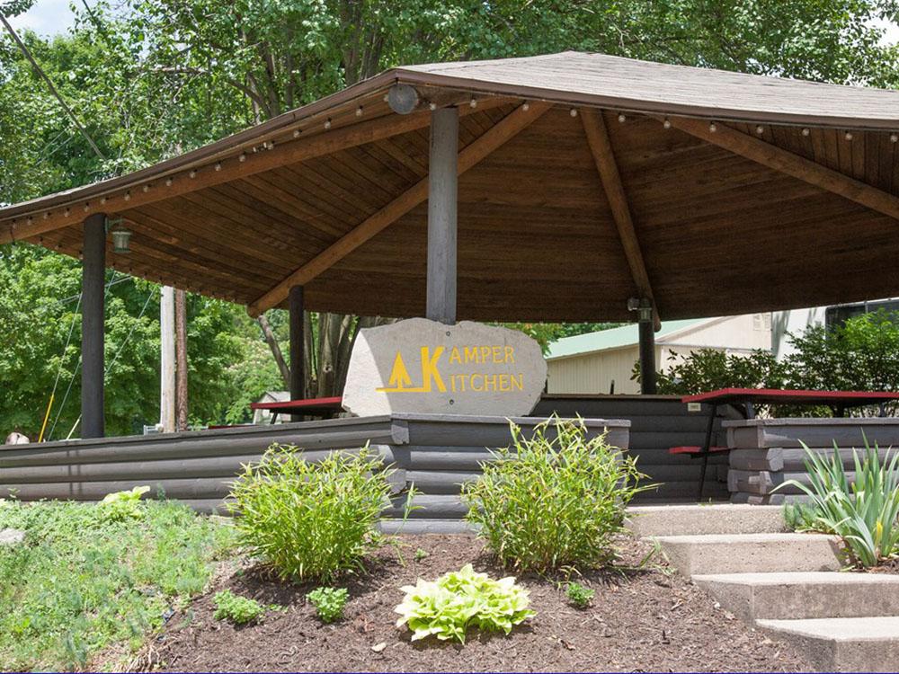 Picnic benches under the pavilion at RENFRO VALLEY KOA HOLIDAY