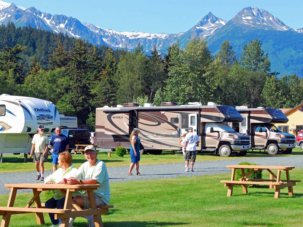 RV sites with snow capped mountains in the background at HAINES HITCH-UP RV PARK