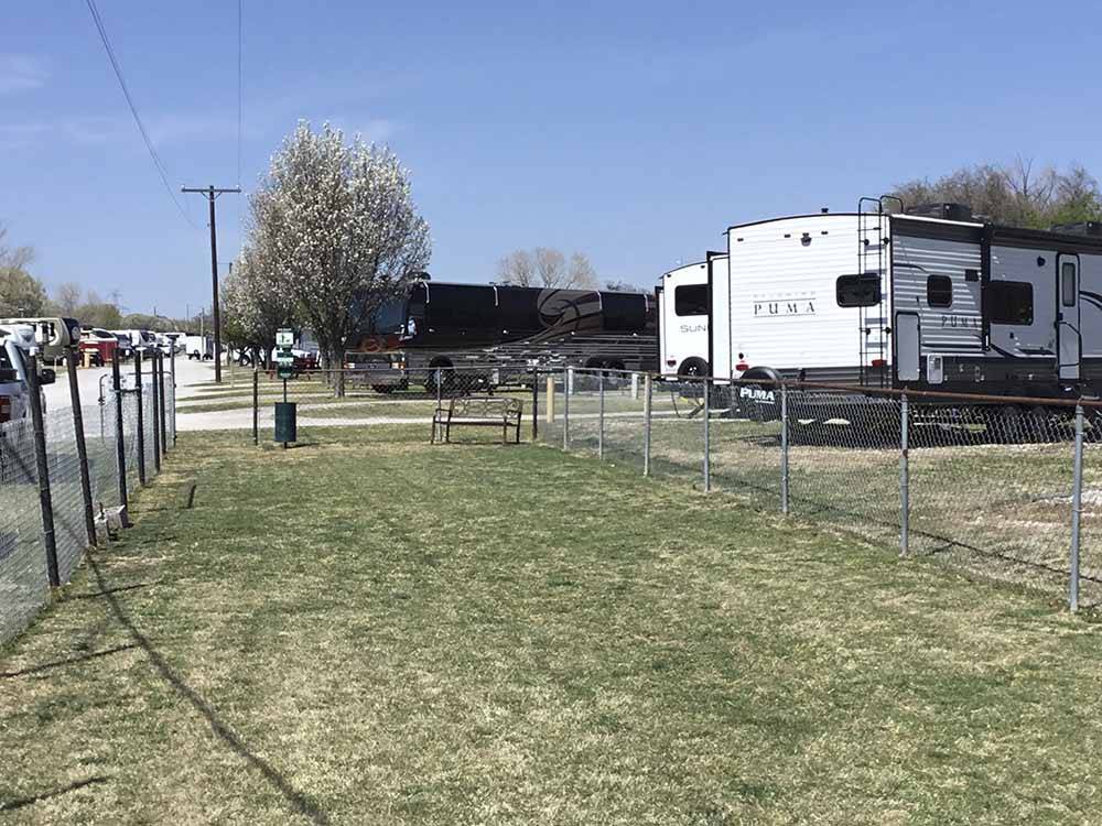 The fenced in pet area at COWTOWN RV PARK