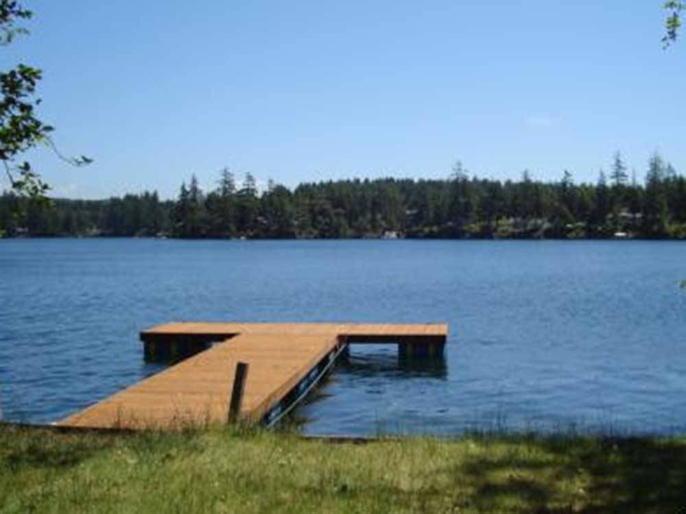 Long pier at the lake at WOAHINK LAKE RV RESORT