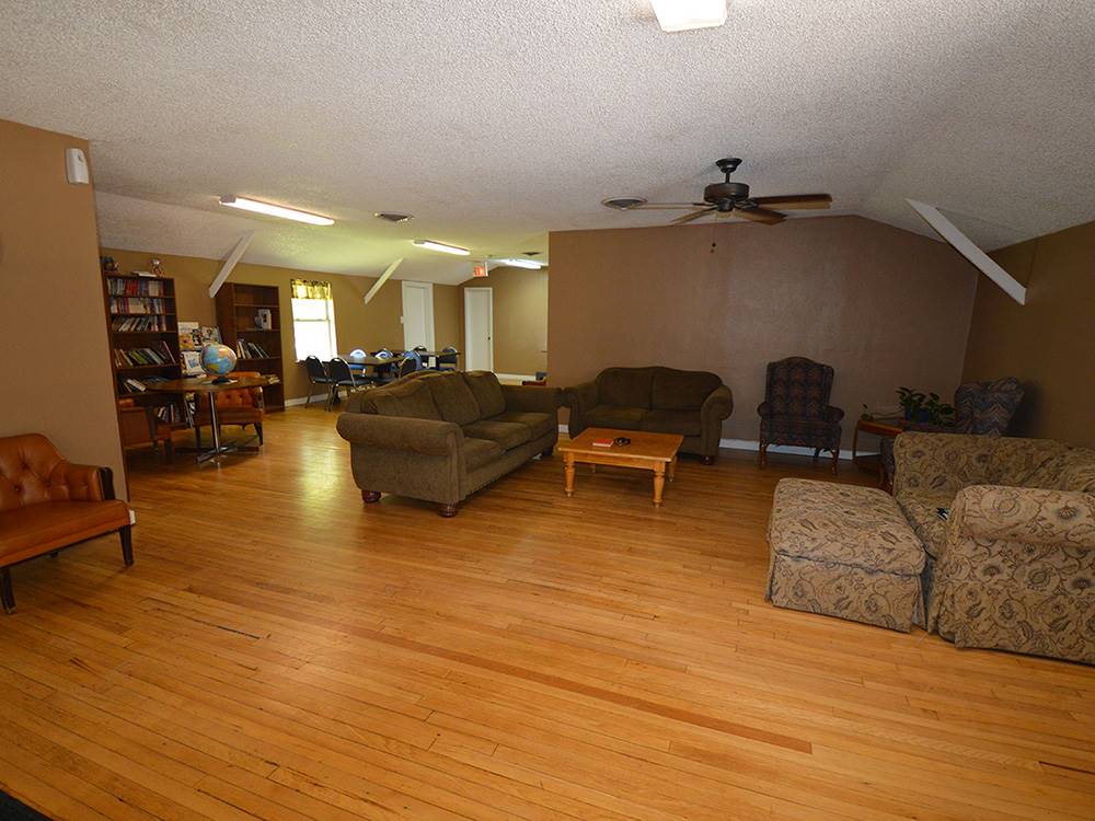 Indoor seating area with couches and chairs at LUBBOCK RV PARK