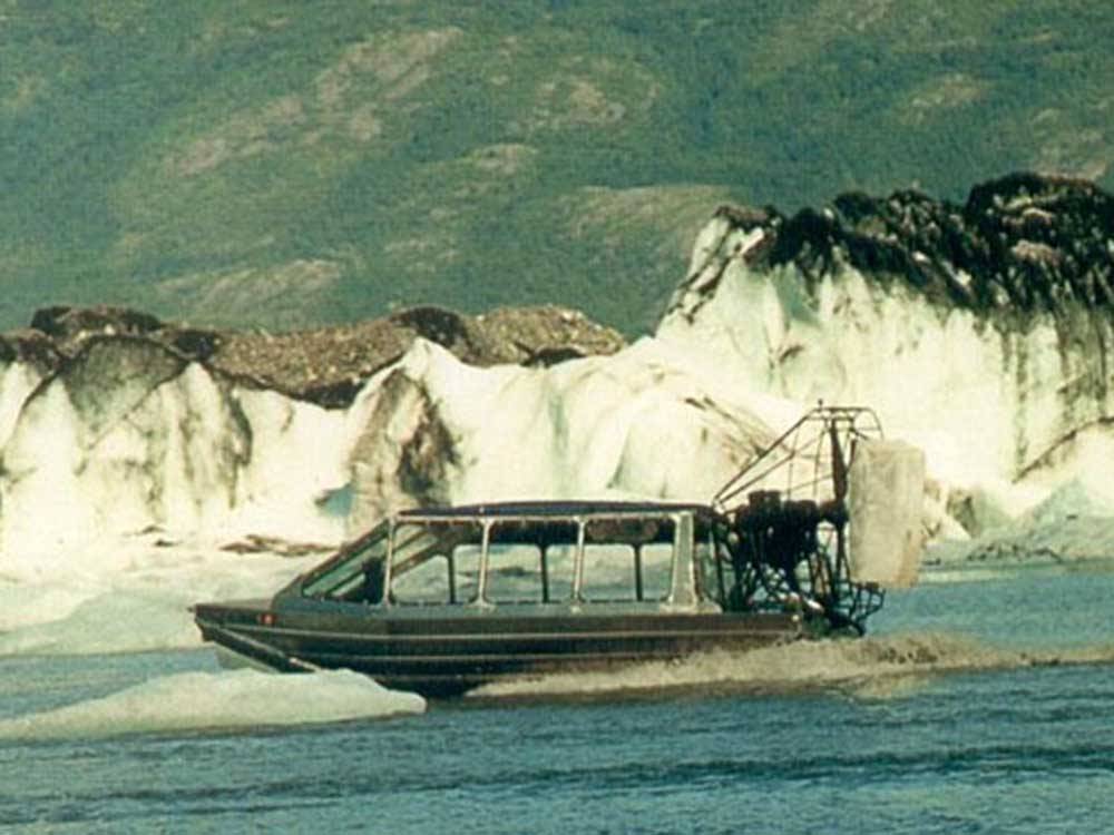A boat traveling near glaciers near MOUNTAIN VIEW RV PARK