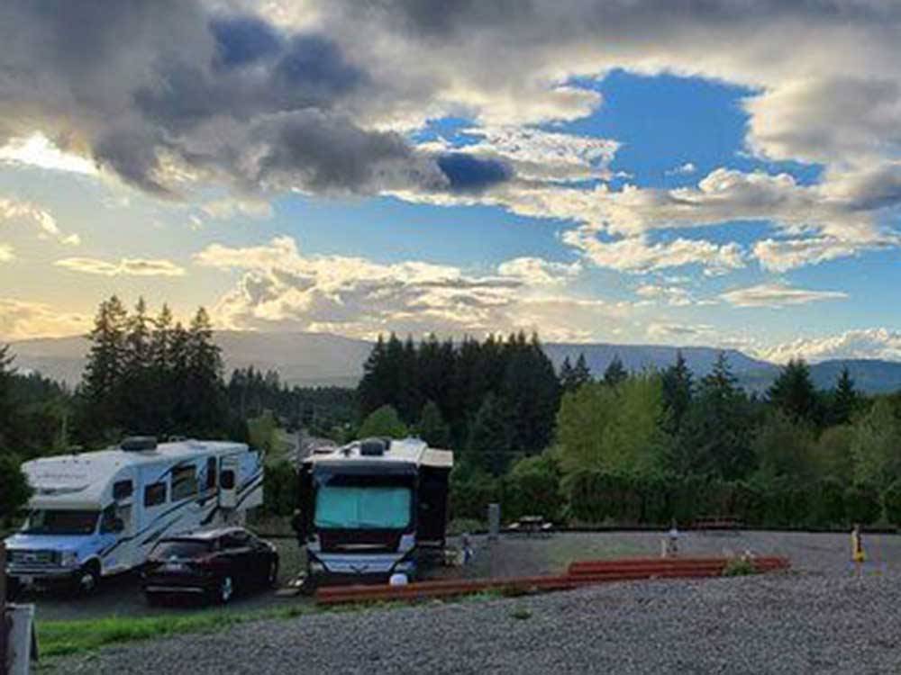 Cars and RVs on-site at dawn at MT ST HELENS RV PARK