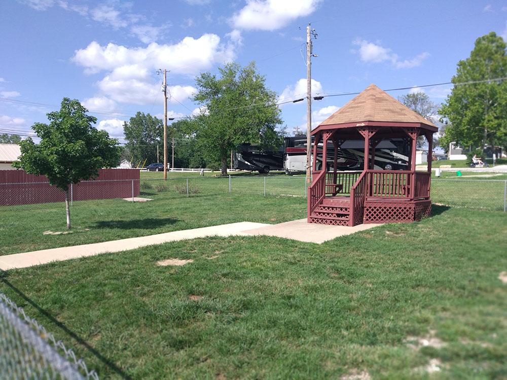 A gazebo in the fenced pet area at PINE GROVE MHC & RV COMMUNITY
