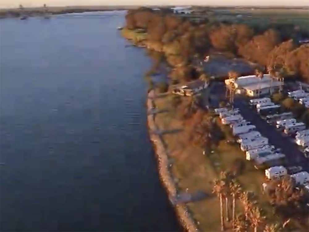 An aerial view of the RV sites by the water at DUCK ISLAND RV PARK & FISHING RESORT