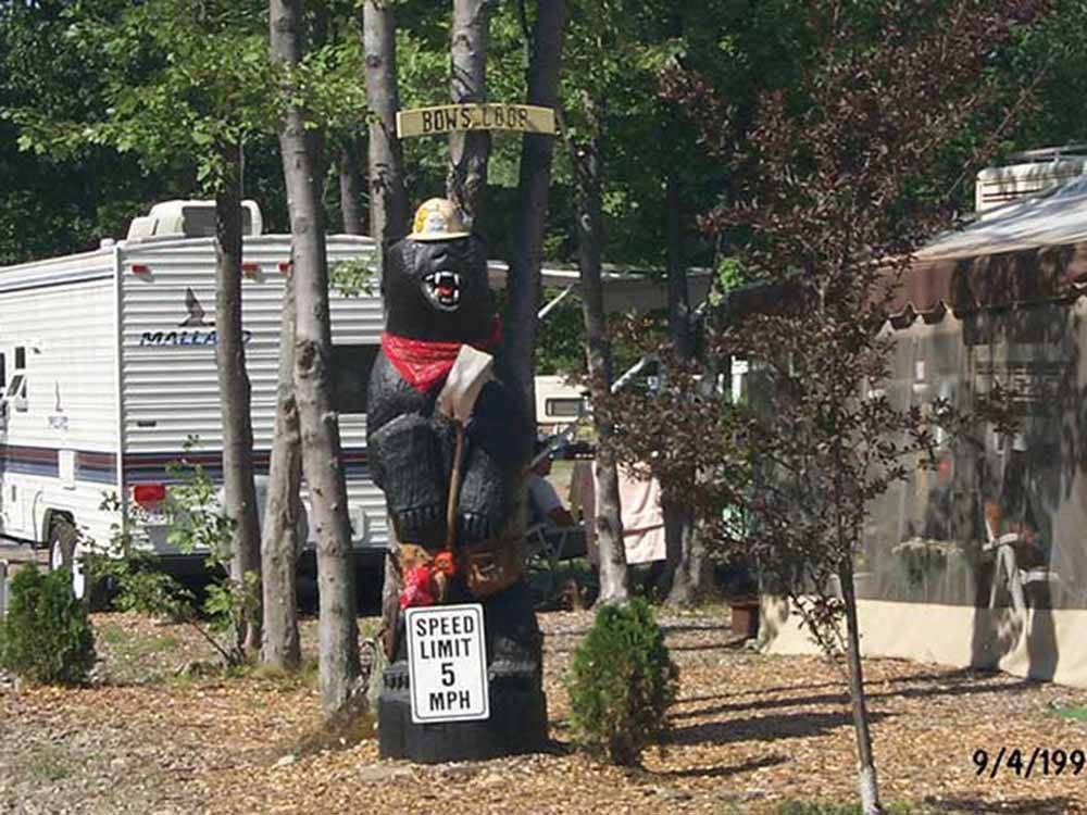 Statue of bear with construction hat and bandana at BLACK BEAR CAMPGROUND