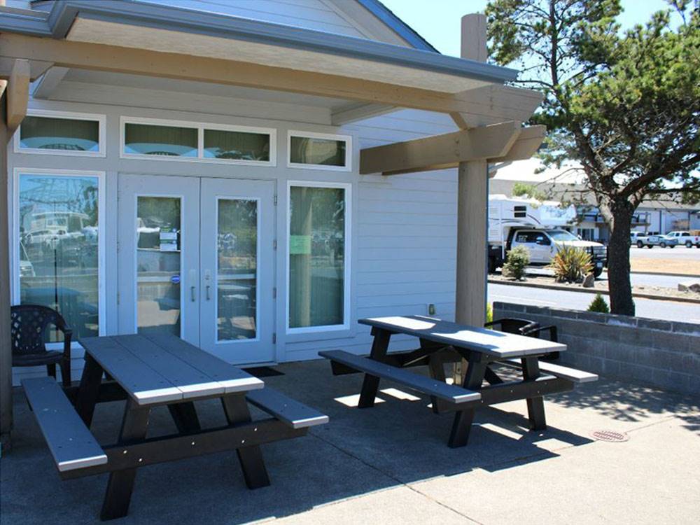 Picnic tables outside of a building