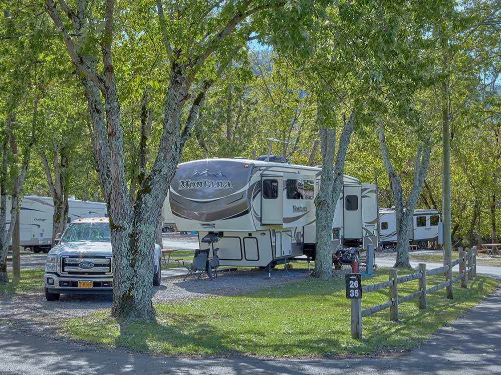 A fifth wheel trailer in a pull thru site at CLABOUGH'S CAMPGROUND