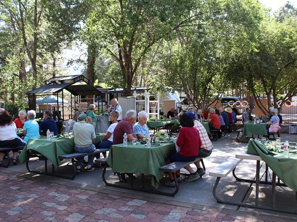Guests dining in large outdoor area at J & H RV PARK