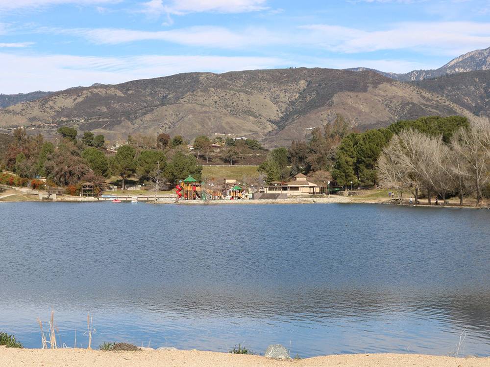 View of lake, hills and playground
