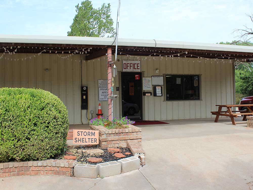 Campground office festooned with decorative lights at ELK CREEK RV PARK