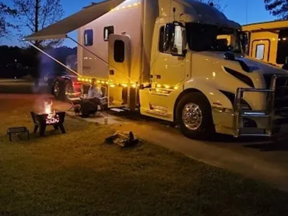 RV at night with firepit outside