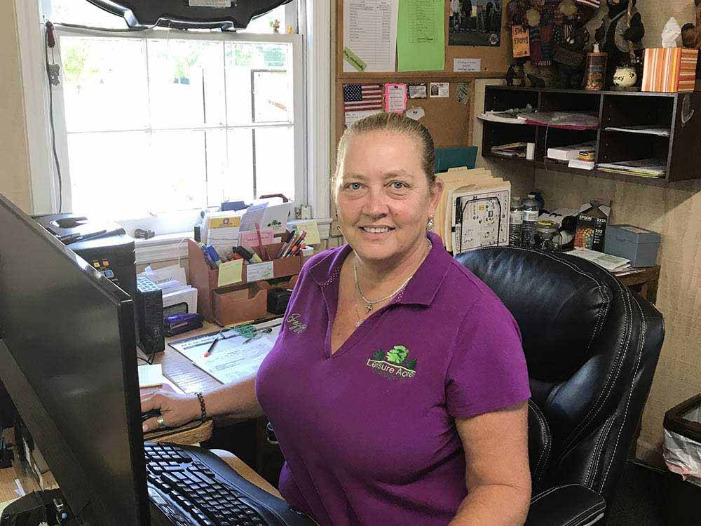 A woman working at the front desk at LEISURE ACRES CAMPGROUND