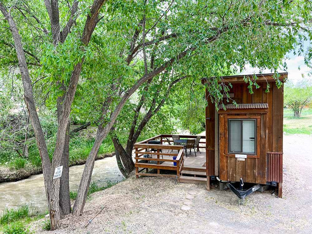 Side view of the tiny home at CEDAR CREEK RV PARK