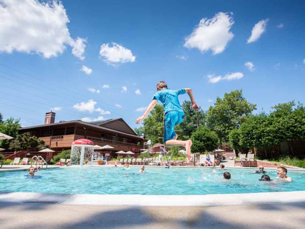 A child jumping into the pool at CHERRY HILL PARK