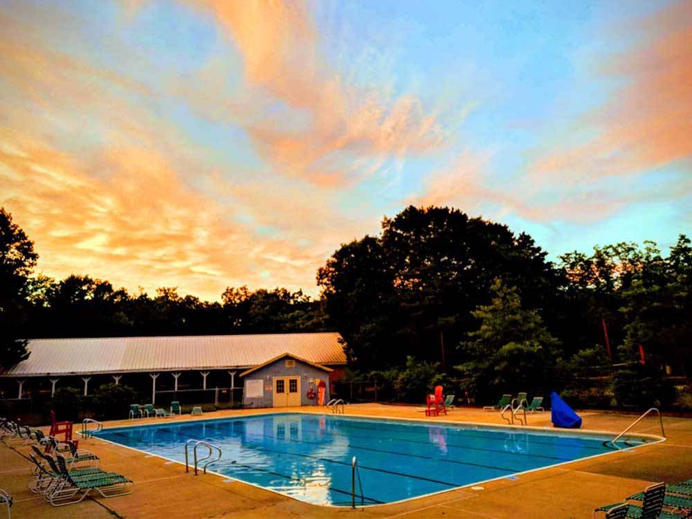 The swimming pool at sunset at INDIAN ROCK RV PARK