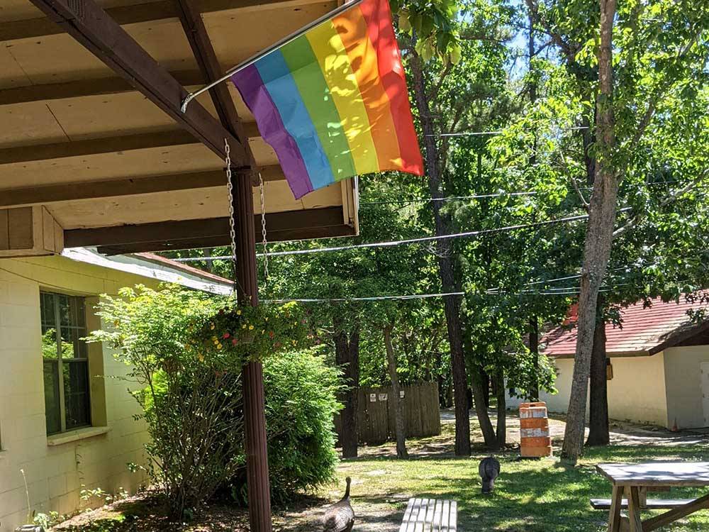 A pride flag flying at the front office at INDIAN ROCK RV PARK