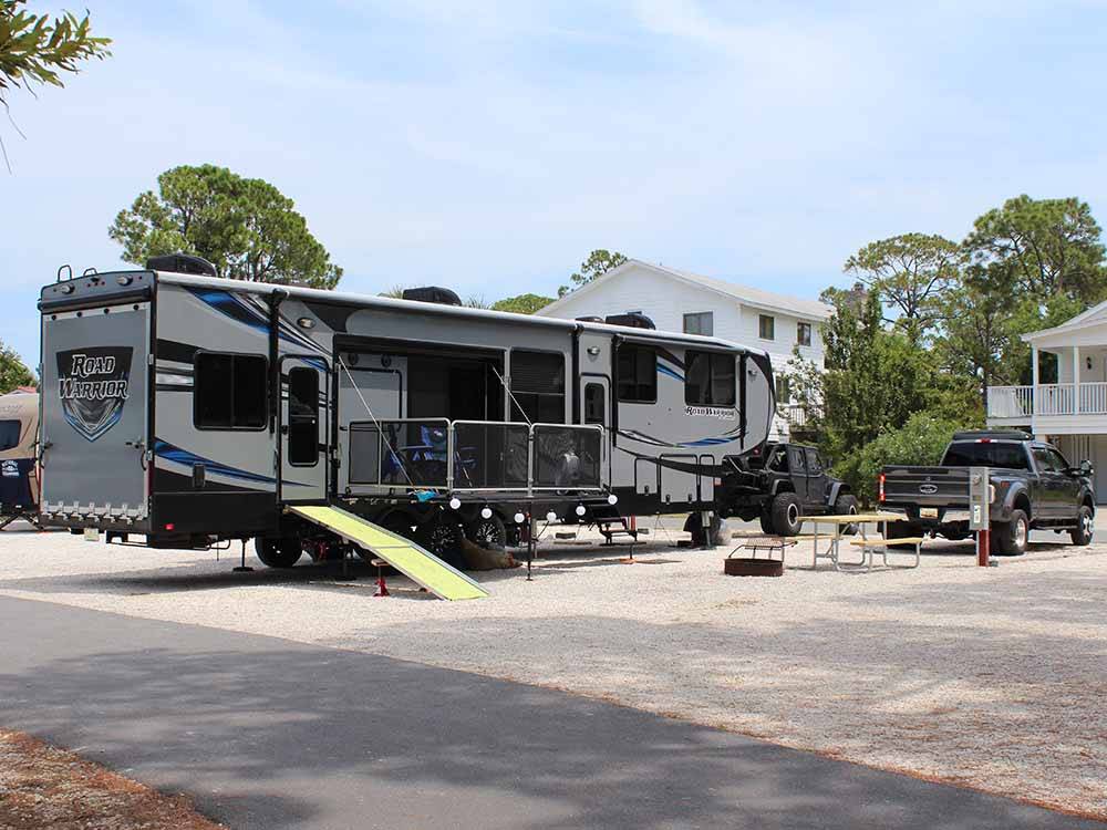 A toy hauler parked in one of the RV sites at RIVER'S END CAMPGROUND
