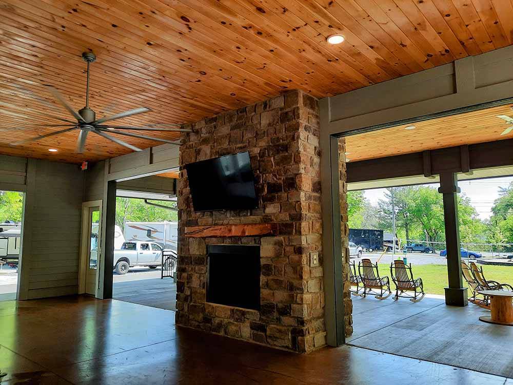 The indoor fireplace with doors on both sides at PIGEON FORGE RV RESORT