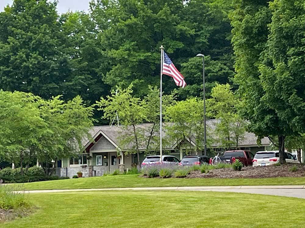 Main building surrounded by trees at INDIGO BLUFFS RV PARK AND RESORT