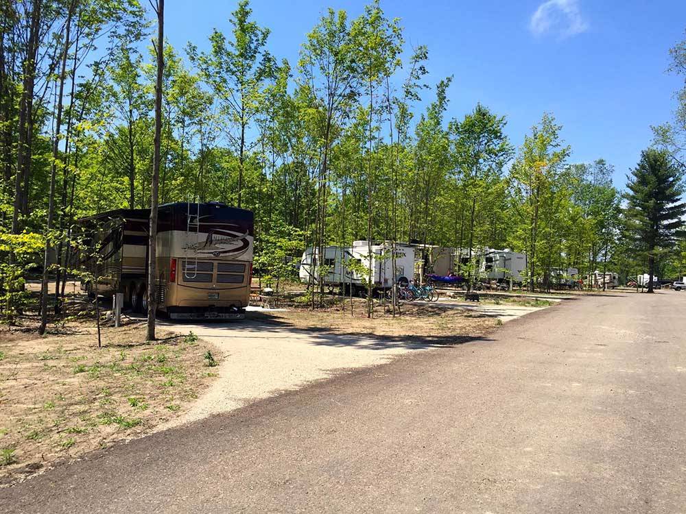 Road leading to parked RVs at INDIGO BLUFFS RV PARK AND RESORT