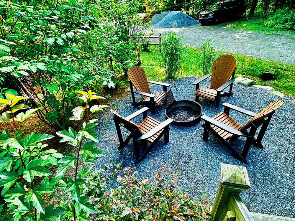 Adirondack chairs around a fire pit