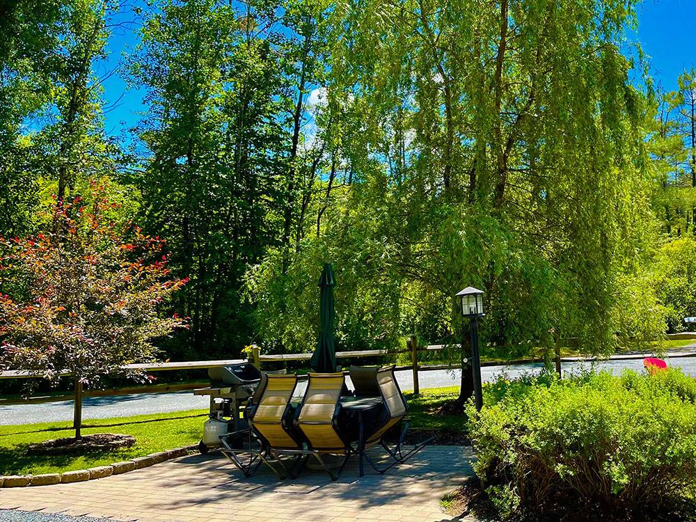 Patio furniture and grill on brick pad